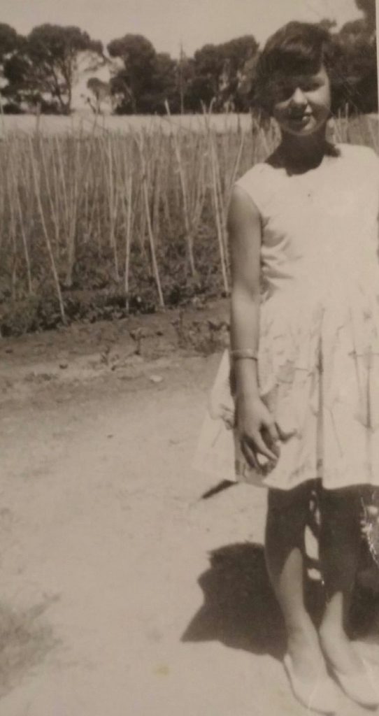 Irene, in front of market gardens, c1961